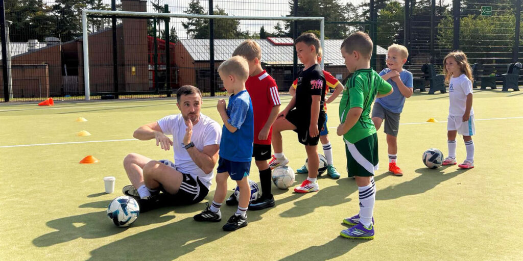 coaching kids during an afterschool football programme with ambassadors ireland