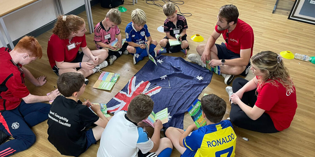 volunteer leaders leading a group of af camp kids during ttg lesson time