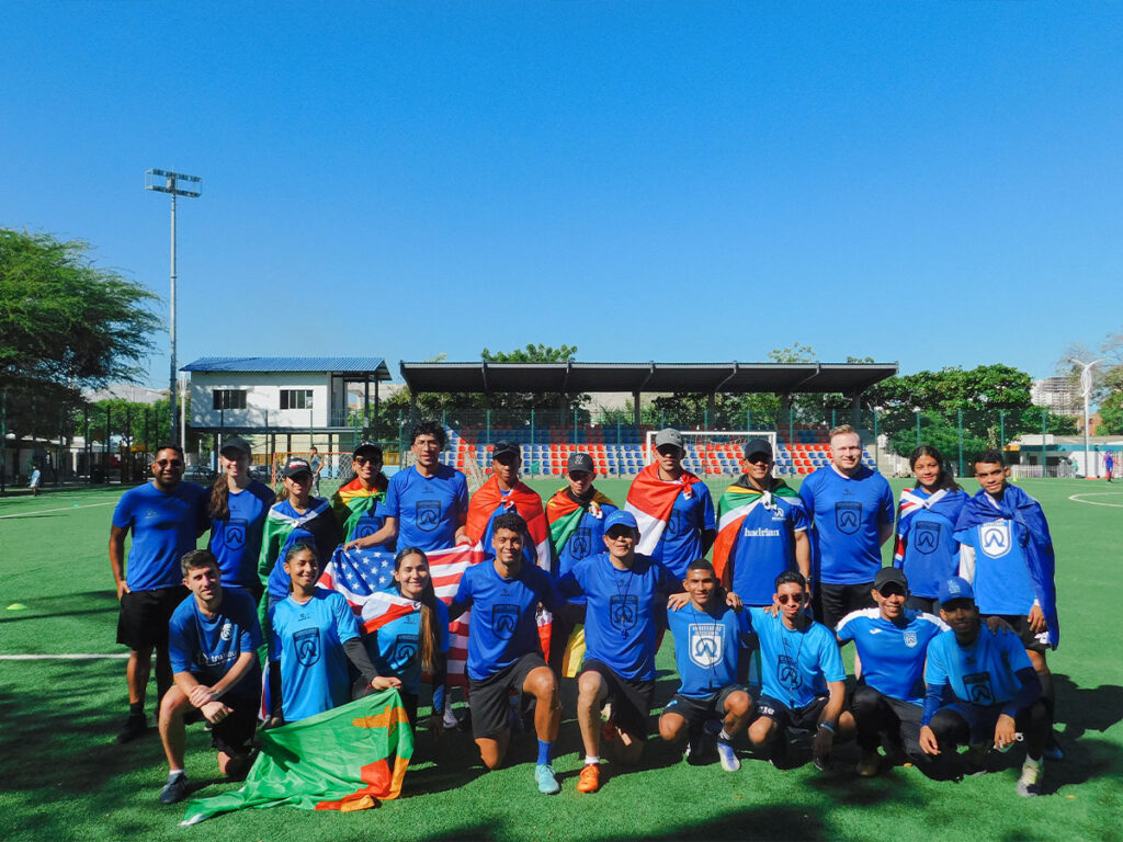 coaches from around the world holding flags
